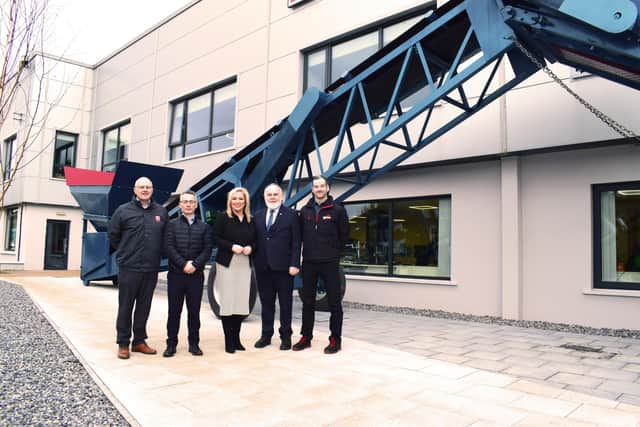 Dominic Molloy, Chair of Mid Ulster Council, Sean Loughran, Powerscreen Business Line Director & General Manager of Terex Dungannon, First Minister Michelle O’Neill, Francie Molloy, Sinn Fein and Conor Kennedy, Operations Director at Terex Dungannon in front of the MK1, one of Powerscreen's first machines.Credit: Submitted