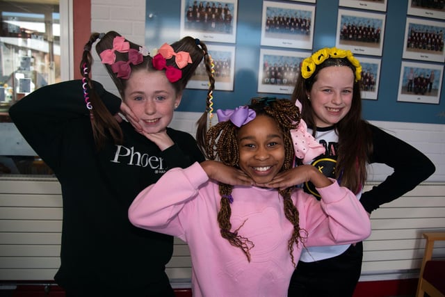 Taking a pose and showing off their Funky Hair Friday styles are Ballyoran Primary School Year 6  pupils from left, Ruby, Miriam and Sophia. PT12-250.