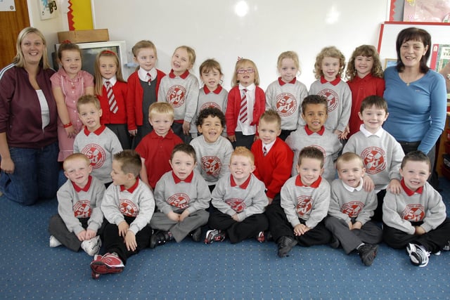 New primary one pupils at St John the Baptist Primary School in 2007 pictured with teacher Mrs Nuala McAlinden, right, and classroom assistant Kirsty Liggett.