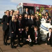 Pictured in 2007 are Noel Doran (teacher), John Donnelly (teacher), Suzanne O'Neill (Safety Bus Co-ordinator), Michael Murray (Safety Bus Co-ordinator), Inspector Steven Reid and Sharon Mullan (Communication Manager Michelin), with pupils from the Ballymena Academy and the Translink safety bus. BT41-200AC