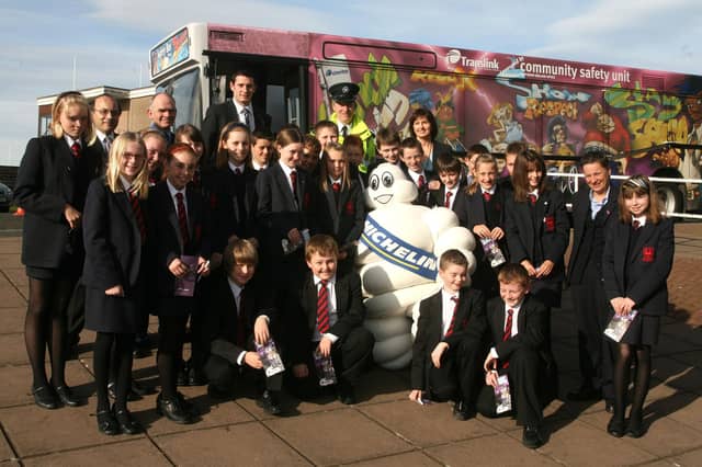 Pictured in 2007 are Noel Doran (teacher), John Donnelly (teacher), Suzanne O'Neill (Safety Bus Co-ordinator), Michael Murray (Safety Bus Co-ordinator), Inspector Steven Reid and Sharon Mullan (Communication Manager Michelin), with pupils from the Ballymena Academy and the Translink safety bus. BT41-200AC