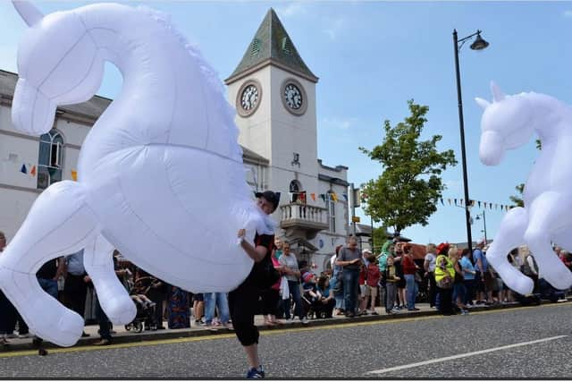 Crowds enjoy a previous May Fair parade makes it`s way past the Square in Ballyclare. INNT 22-011-PSB