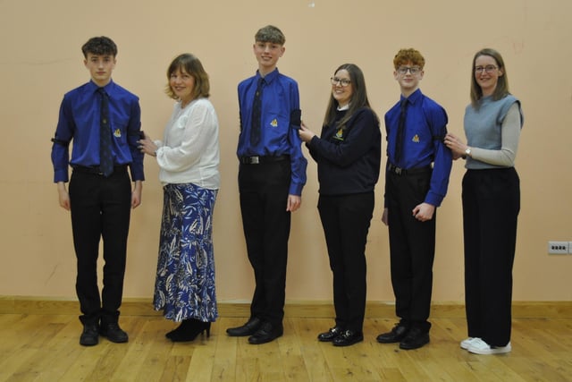Three boys from Company section receiving their President's Badge from their mothers. From left to right, Joseph Alexander and mum Christine, Ross Quinn and mum Susanna, Sam Hanna and mum Lesley.