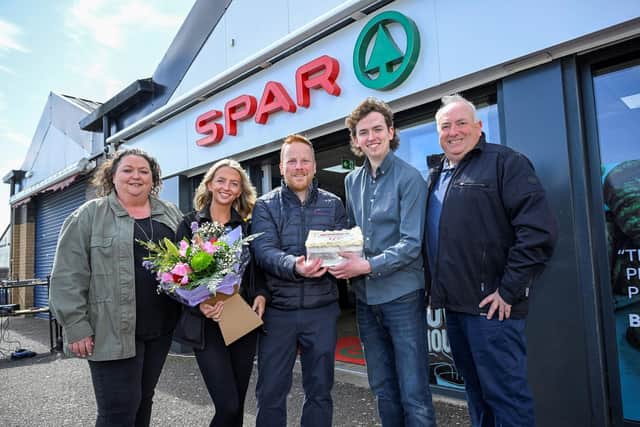 Alyson, Emma, Alex and Ronnie Eynon with Darren Turtle from Henderson Group, celebrating 10 years of Spar Craigyhill. Photo: JComms