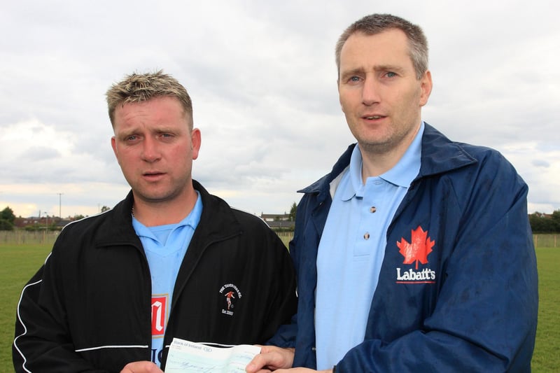 Sponsor Craig Black of the Bush Tavern presents a cheque to Manager of Taverners and organiser of the Mini Milk Cup Richard McNabb back in 2009