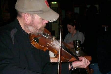 Marinus (Marinie) Toman playing the fiddle in Dunkineely, Co Donegal