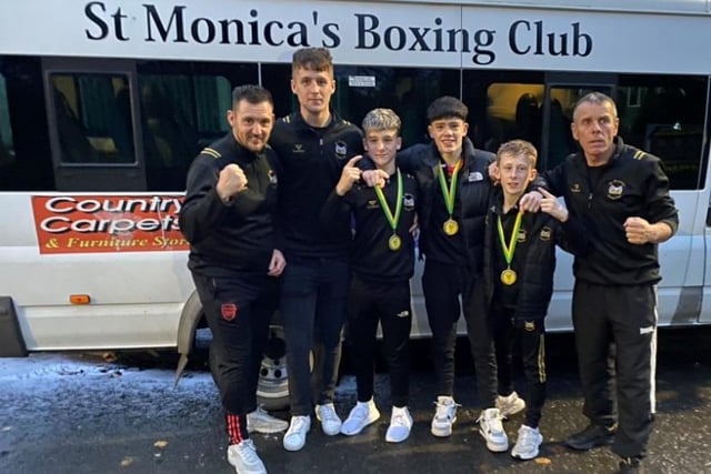 St Monica's Boxing Club Champions, James McCann, Daire McGuinness, Joseph McParland, with their coaches Owen Murphy and Dessie Toman.