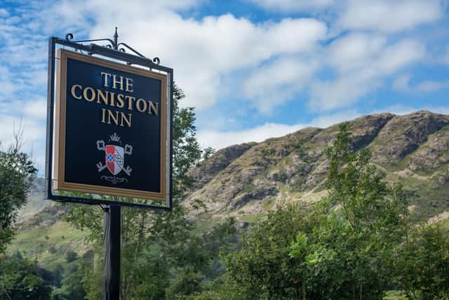 Sign of success, dwarfed by The Old Man of Coniston