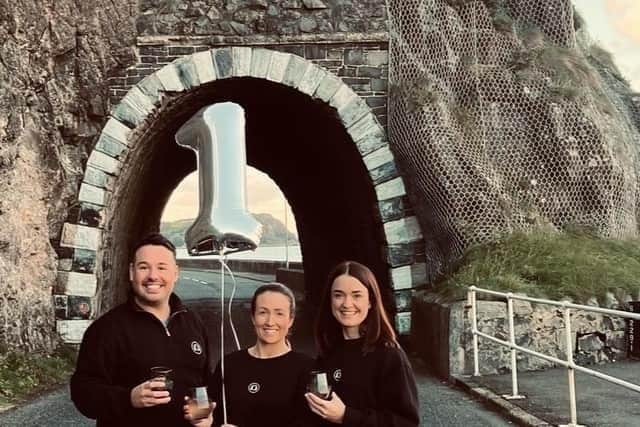 Larne residents Kerrie McKay, Graham Boyd and Karen Fergie innovators of Black Arch Gin celebrate first year in business.