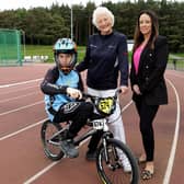 Ethan Abbott, Lady Mary Peters and Emma Haughian, Marketing Manager at Hughes Insurance. Pic Credit: Mary Peters Trust