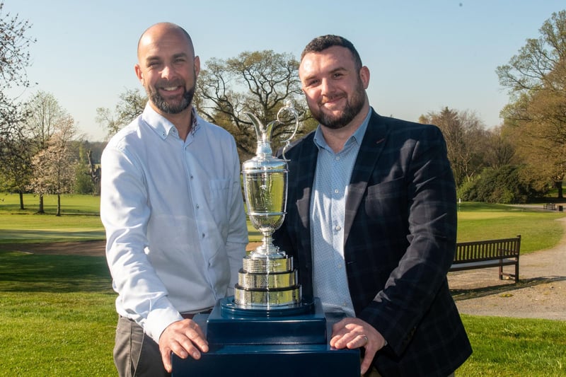 Posing happily with the Claret Jug are, Alastair Glass, left, and James Hall. PT14-296.