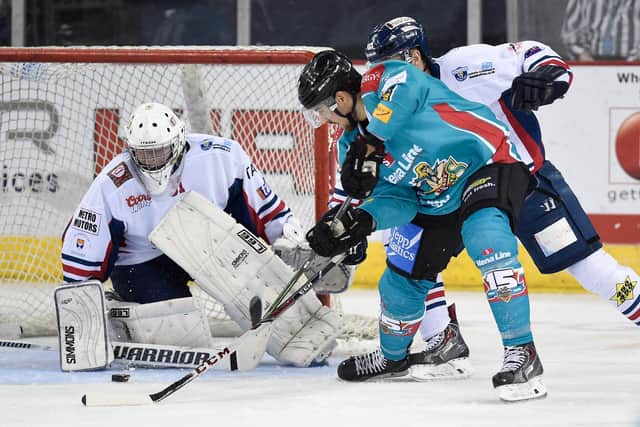 Ray Sawada of the Belfast Giants has his shot saved by Craig Holland in the 9-3 victory over the Dundee Stars during the Elite League game at the Odyssey Arena, Belfast in 2014. Picture © Michael Cooper
