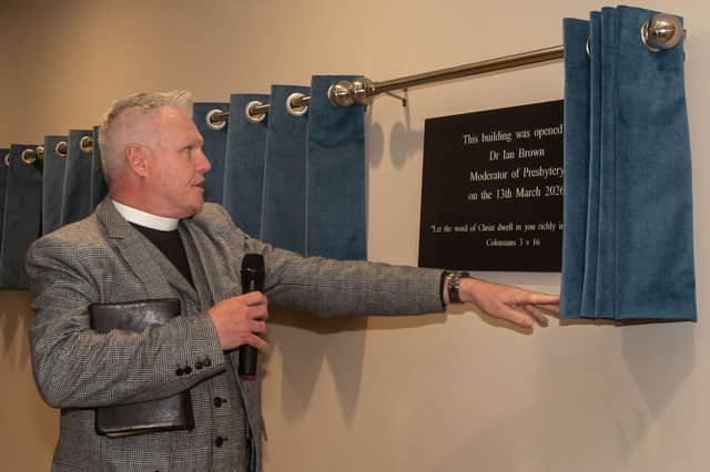 Free Presbyterian Church moderator Dr Ian Brown unbeils one of the plaques at the opening of the new Whitefield College of the Bible.