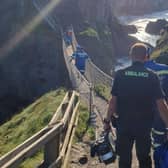 Following the rescue, Coleraine Coastguard posted this photo on their Facebook page with the caption: "The long walk home across the famous Carrick-a-Rede rope bridge following this afternoon’s callout! Breathtaking!" Credit: Coleraine Coastguard