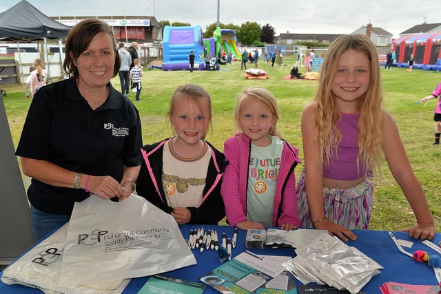 Lynette Cooke, PCSP development manager, pictured at the Portadown Football Club community fun night with, from left, Amelia Stevenson (8), Gracie Lutton (8) and Charlotte Stevenson (5). PT30-201.