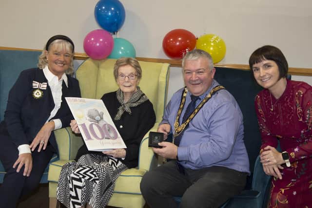 Deputy Lieutenant of County Londonderry Lorraine Young, 100-year-old Sadie Gage, the Mayor of Causeway Coast and Glens Borough Council, Councillor Ivor Wallace, and Hezlet Court Scheme Co-ordinator Gillian Rea pictured at Sadie’s 100th birthday celebrations