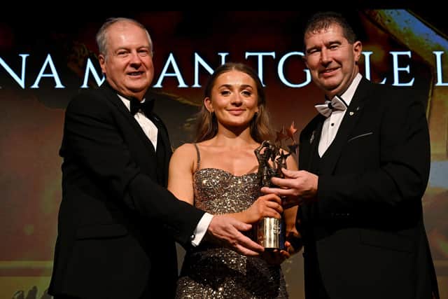 16 November 2024; Grace Ferguson of Armagh is presented with her All-Star award by Ard Stiúrthóir TG4 Alan Esslemont and President of the LGFA, Mícheál Naughton during the TG4 Ladies Football All Stars Awards banquet, in association with Lidl, at the Bonnington Dublin Hotel in Dublin.  Photo by Brendan Moran/Sportsfile