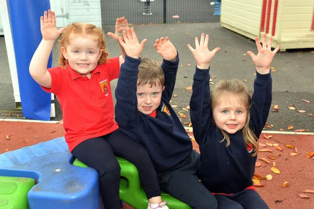 Enjoying playing together at Orchard County Primary School nursery unit are pupils from left, Hollie, William and Bella-Rose. PT41-323.