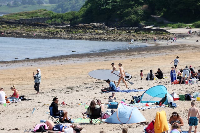 Visitors enjoy their day at the beach at Helen’s Bay, Co. Down.