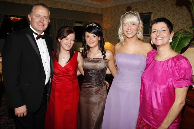 Mr. Laverty, principal in 2009, and Madame Skobel, vice-principal, pictured with Carly Law, Nicola Tanner and Megan Wright at the Coleraine College Formal.
