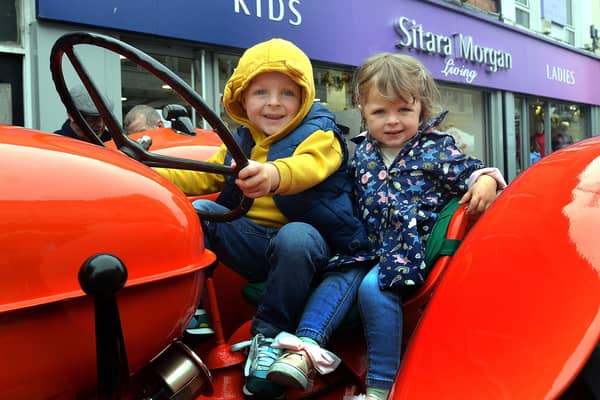 Sitting pretty on a vintage tractor at Country Comes To Town on Saturday are Ronnie and Rosie McCann. PT38-219.