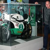 Pictured beside Joey Dunlop's bike which features in the exhibition, left to right, Ryan Farquhar, Philip McCallen and son of Joey Dunlop, Gary Dunlop. Photograph by Declan Roughan / Press Eye