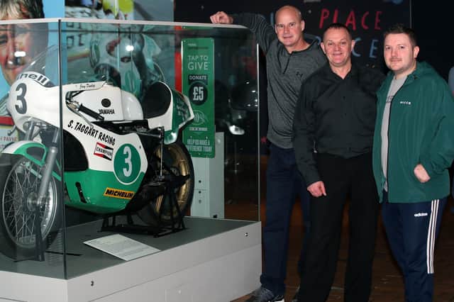 Pictured beside Joey Dunlop's bike which features in the exhibition, left to right, Ryan Farquhar, Philip McCallen and son of Joey Dunlop, Gary Dunlop. Photograph by Declan Roughan / Press Eye