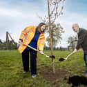 Cllr Thomas Beckett, Chair of Communities and Wellbeing Committee, Lisburn and Castlereagh City Council, joins Helen Halliday, Senior Programme Manager, Translink, to plant maple trees at Wallace Park in Lisburn to mark the conclusion of the major Lisburn Area Renewals (LAR) project. Pic credit: McAuley Multimedia