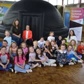 Local storyteller, Vicky McFarland with Christine Barnhill, MEABC Economic Development Officer and pupils from Whitehead Primary School.  Photo: Mid and East Antrim Borough Council