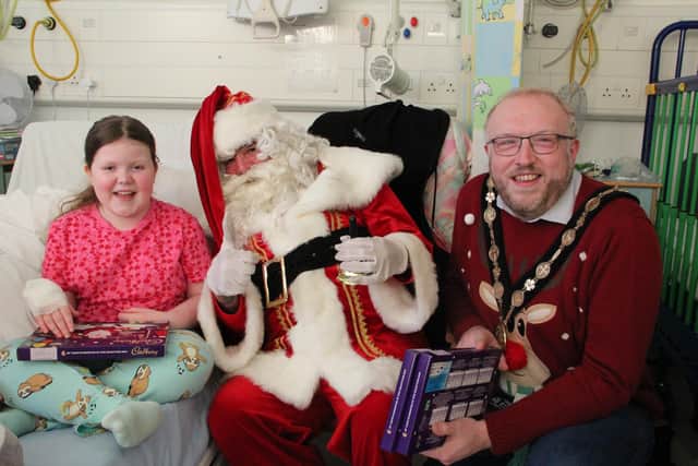 Lydia Harrison with Santa and Mayor, Cllr Andrew Gowan. Pic credit: SEHSCT