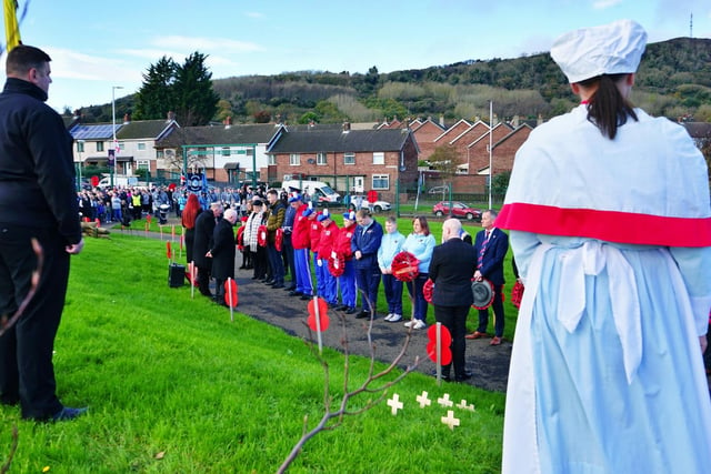 The community paused to remember the fallen from World War I, World War II and subsequent conflicts.