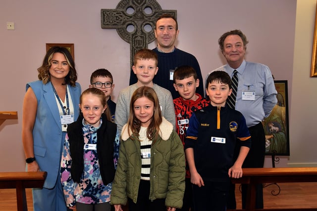 Prospective pupils pictured in the St John the Baptist's College Oratory during the school open day with adults from left, Charlotte Conway, head of RE, Tom King, RE teacher, and Jim McConville, member of the school board of govenors. PT03-213.