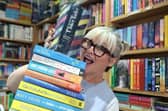 Lesley Price, from Bridge Books, Dromore, proudly displaying her Ulster Tatler 'Businesswoman of the Year' award on top of a pile of books she has recently read and loves. Photo: Lesley Price