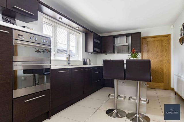 The kitchen has an excellent range of integrated appliances including Baumatic eye level oven and grill, dishwasher and four-ring gas hob with stainless steel extractor and a stainless steel sink and drainer.