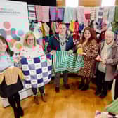 Mayor and Council's Health and Wellbeing team present Baby Basics with some tiny knits. Picture: Antrim and Newtownabbey Borough Council