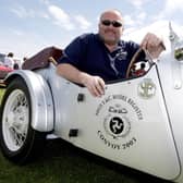 Paul Mullan pictured with his late father's 1937 Model Y Special during the Ford Fair at the Dunluce Centre in 2009