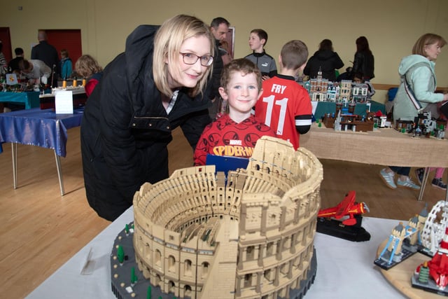 Colossal structure...Niamh English and son, Aidan (6) admire the Roman Colosseum model at the Lego exhibition. PT15-213.