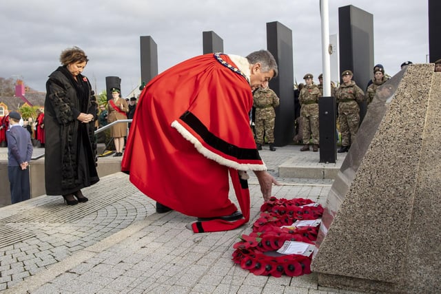 The Mayor, Alderman Noel Williams,  laying a wreath at Carrickfergus War Memorial.