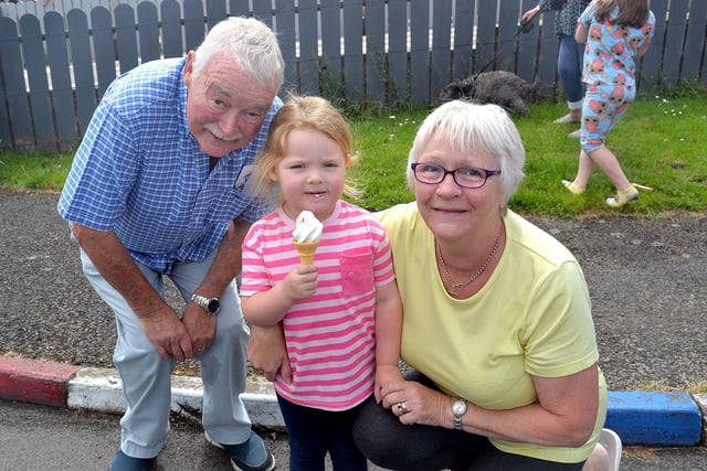 Little Rosie Vennard (3) was treated to an ice cream by grandparents Eddie and Ann Vennard at the Edgarstown pre-bonfire fun day. PT27-297.