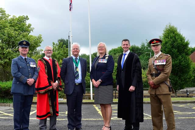 Pictured at the raising at the Armed Forces Flag at Lagan Valley Island are: Wing Commander Steve McCleery; Alderman Owen Gawith, Corporate Services Chairman; DL High Sheriff of Co Antrim Mr Peter Thomas Watts Mackie; Deputy Lord Lieutenant of County Antrim Mrs Pauline Shields OBE DL; Mr David Burns, Chief Executive of Lisburn & Castlereagh City Council and Lt Col Simon Whittaker. Pic Credit: LCCC