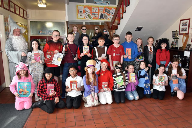Well read ... Pupils of St John The Baptist Primary School and Bunscoil who dressed up to mark World Book Day. Also included is school principal, Mr John McComb, left. PT10-220.