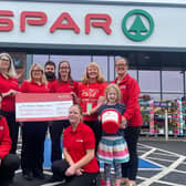 Pictured at SPAR Route Service Station in Ballymoney are representatives from the five participating stores, Aaron Galbraith, Rea Turner, Sharon Moore, Nicola McCloskey, Chris Stewart, Catherine Campbell, AANI representative Tracy Strachan, Deborah McGuigan, Molly McGuigan and Tracey Boyd. Credit JComms