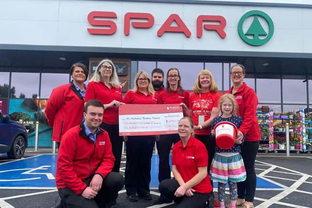 Pictured at SPAR Route Service Station in Ballymoney are representatives from the five participating stores, Aaron Galbraith, Rea Turner, Sharon Moore, Nicola McCloskey, Chris Stewart, Catherine Campbell, AANI representative Tracy Strachan, Deborah McGuigan, Molly McGuigan and Tracey Boyd. Credit JComms