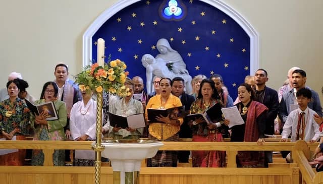 Singing together at the International Mass at St Peter's Church in Lurgan, Co Armagh.
