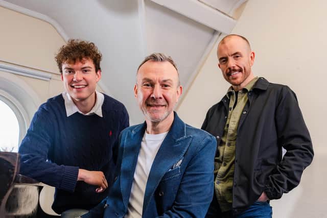 Lisburn man Ashley Fulton celebrates his 25th anniversary as a vocal coach with his first student Conleth Kane and Nathan Thompson, his 100th student. Pic credit: Ashley Fulton