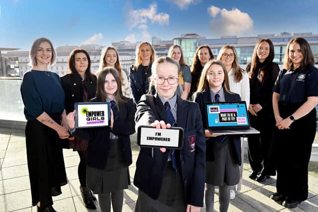 Pictured (Front L-R) are Caeris, Darcy & India Year 8 students from Larne Grammar School who will be participating in the CyberFirst Empower Girls event alongside representatives from (L-R) Aflac NI, Kainos, Microsoft, Amazon Web Services, ESO, BT, Instil and CyberFirst.