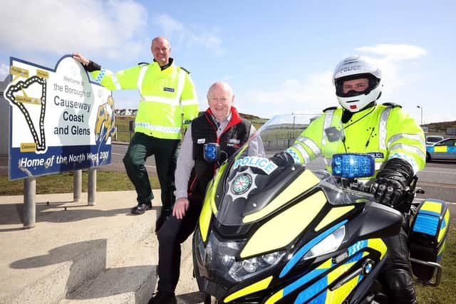 PSNI Chief Superintendent Mark Roberts, NW 200's Mervyn White and a PSNI constable from Roads Policing. CREDIT STEPHEN DAVIDSON