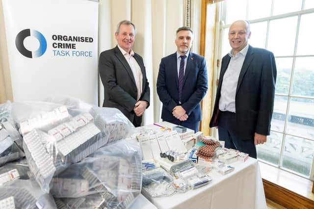 Pictured with the seized drugs are, from left, Richard Pengelly, permanent secretary at the Department of Justice; Detective Chief Superintendent Andy Hill and Peter May, permanent secretary at the Department of Health. Photo submitted by the Department of Justice.