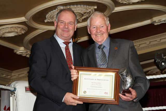 Pat Ryan, President of the Irish Boxing Association, makes a special presentation to Newry man Jackie Poucher for his life-long contribution to boxing.