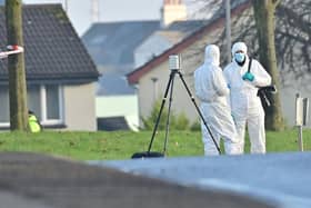 Forensic officers at the scene as police work to establish the circumstances surrounding a sudden death in the Edward Street area of Lurgan. Picture: Colm Lenaghan / Pacemaker